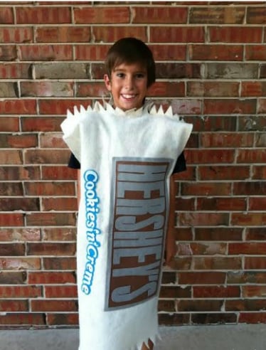 Child in Hershey Bar costume.