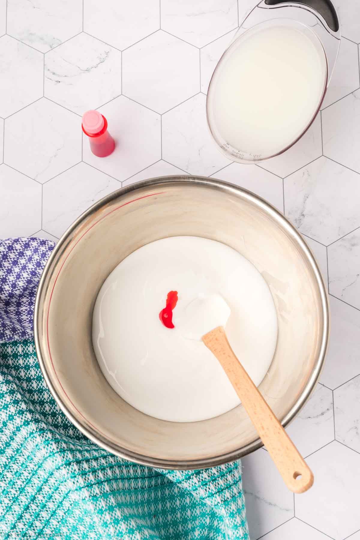 Food coloring added to glue in bowl.