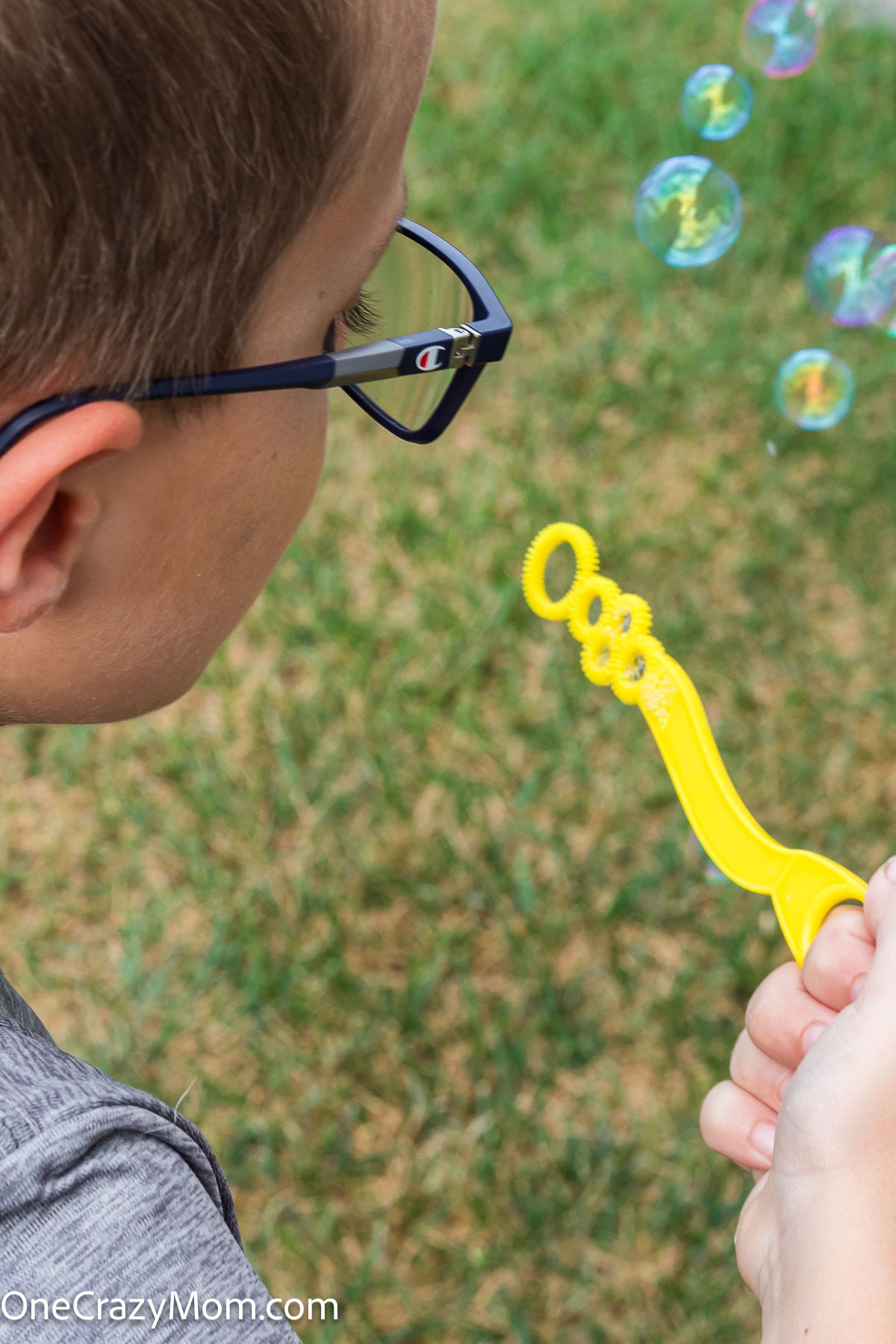 Child blowing bubbles.