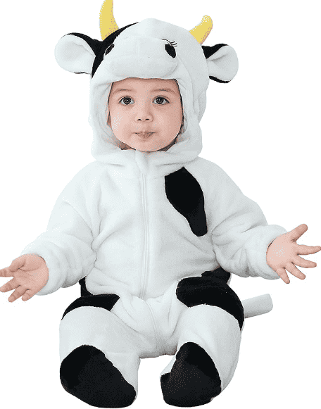 Cow costume on baby sitting up.
