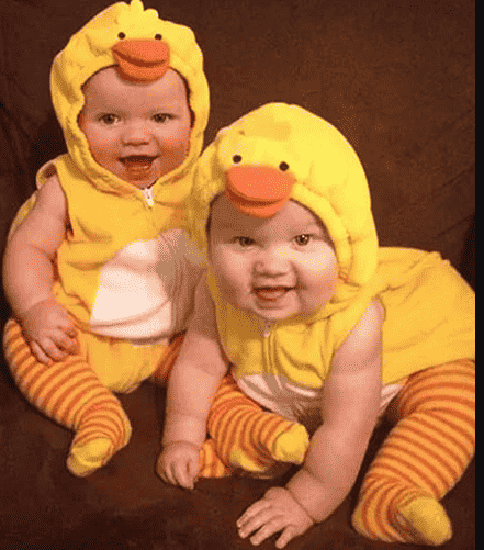 Babies in a duck costume.