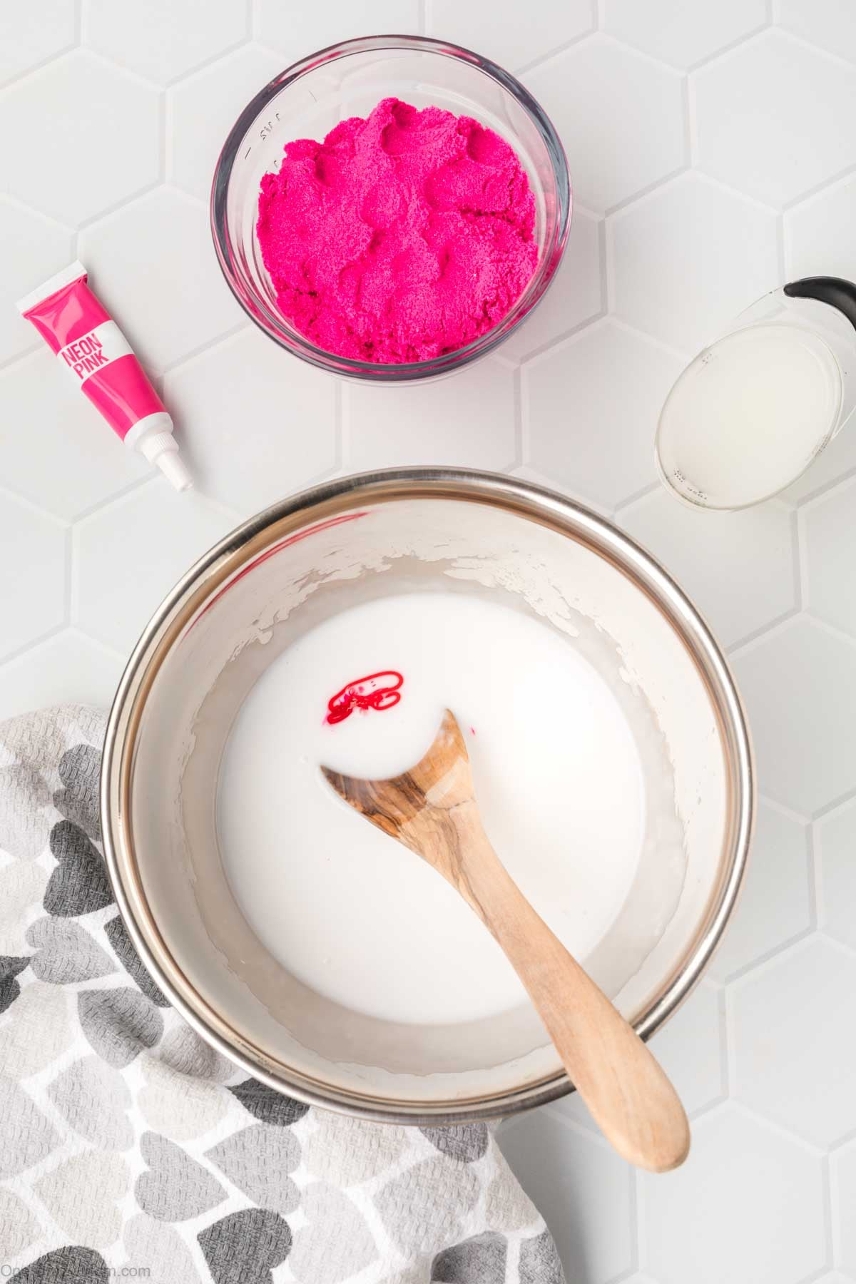 Food coloring added to the glue mixture in bowl.