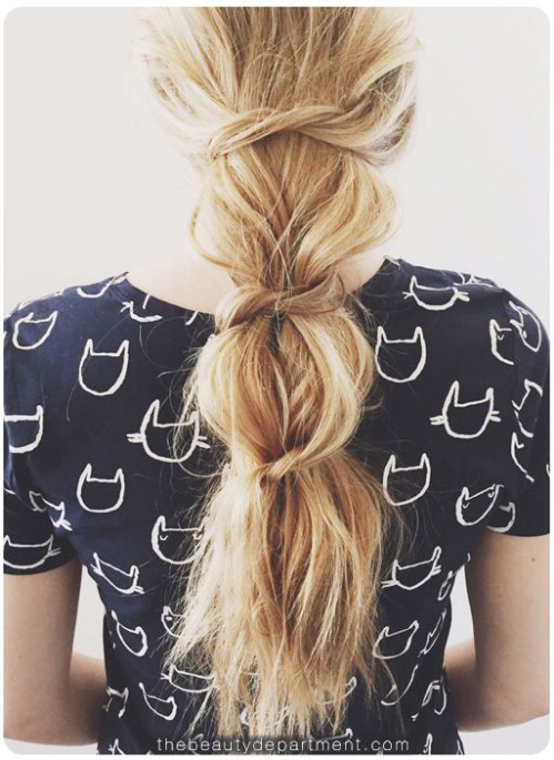 Messy knotted ponytail style.