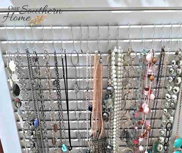Hanging jewelry storage idea using a shutter.