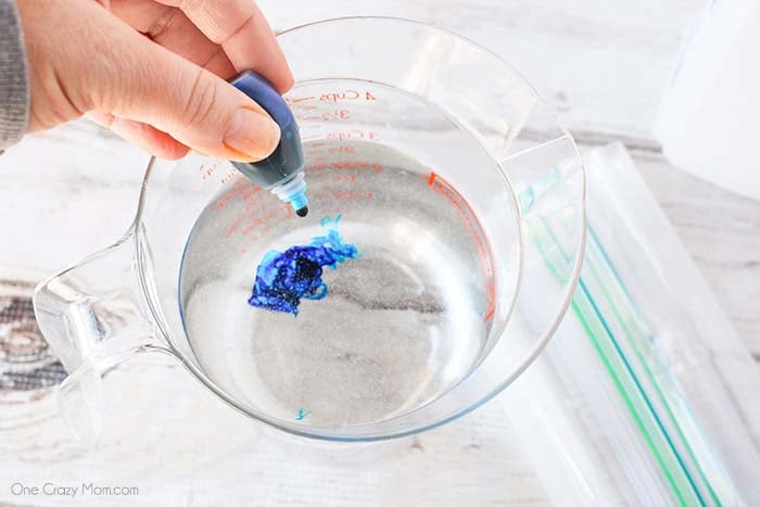Food coloring going into water.