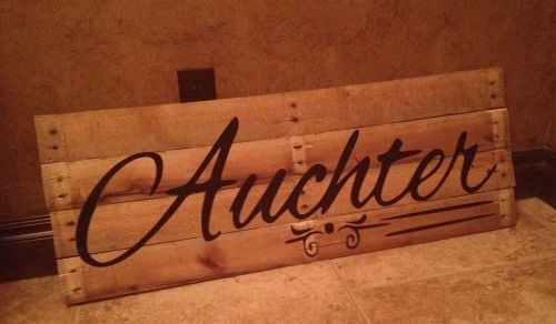 Front of pallet sign with name on it.