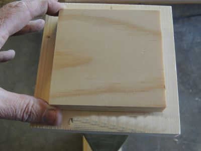 Placing wood on top.