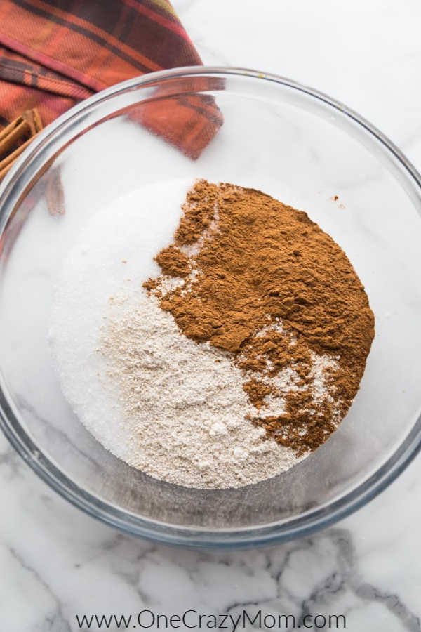 Cinnamon Homemade Bath Salts are so easy to make and smell heavenly. Melt all your stress away when you use these decadent diy bath salts. Bowl with supplies ready to mix.