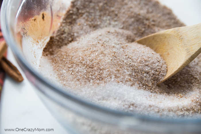 Cinnamon Homemade Bath Salts are so easy to make and smell heavenly. Melt all your stress away when you use these decadent diy bath salts. Spoon in bowl mixing ingredients.