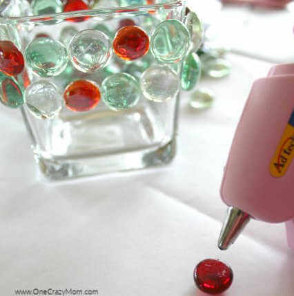 Looking to jazz up your holiday decor on a budget? Try this DIY Dollar Store Christmas Candle Holder that takes only minutes to make and is frugal and easy. Looking to jazz up your holiday decor on a budget? Try this DIY Dollar Store Christmas Candle Holder that takes only minutes to make and is frugal and easy.