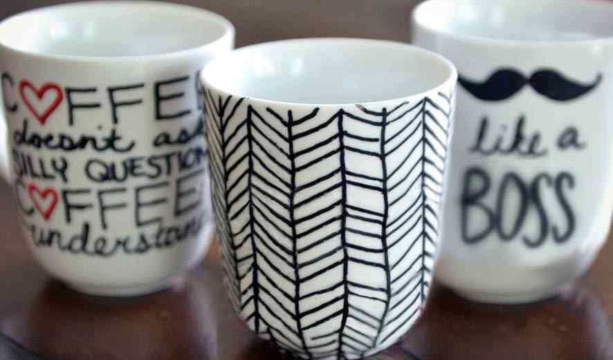 Photo of 3 mugs with sharpie art.