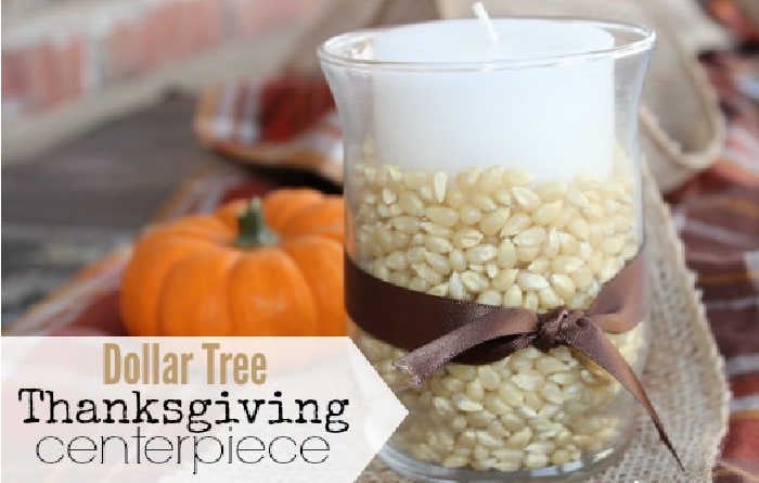 Photo of dollar store Fall candle holder DIY beside a mini pumpkin.