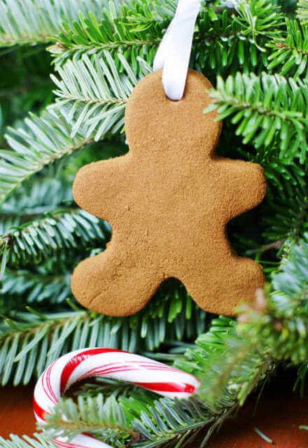 We've rounded up over 30 Easy Homemade Christmas Ornaments. These DIY ornament ideas are simple to make and many use what you already have. Try these fun DIY craft ideas! Your kids will love making these easy handmade ornaments for Christmas! #onecrazymom #christmasornaments #DIYornaments Gingerbread man in tree.