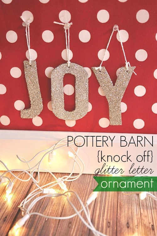 We've rounded up over 30 Easy Homemade Christmas Ornaments. These DIY ornament ideas are simple to make and many use what you already have. Try these fun DIY craft ideas! Your kids will love making these easy handmade ornaments for Christmas! #onecrazymom #christmasornaments #DIYornaments JOY ornaments on wall.