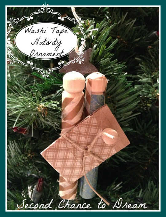We've rounded up over 30 Easy Homemade Christmas Ornaments. These DIY ornament ideas are simple to make and many use what you already have. Try these fun DIY craft ideas! Your kids will love making these easy handmade ornaments for Christmas! #onecrazymom #christmasornaments #DIYornaments Nativity ornament with washi tape on tree.