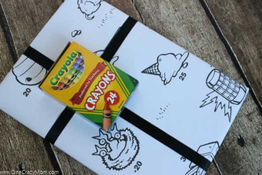 Check out these frugal and creative Christmas gift wrap ideas. Remember, a Christmas gift wrapping idea doesn't have to be hard or expensive. Box wrapped in a coloring sheet with crayons.