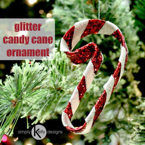 We've rounded up over 30 Easy Homemade Christmas Ornaments. These DIY ornament ideas are simple to make and many use what you already have. Try these fun DIY craft ideas! Your kids will love making these easy handmade ornaments for Christmas! #onecrazymom #christmasornaments #DIYornaments Glitter candy cane ornament in tree.