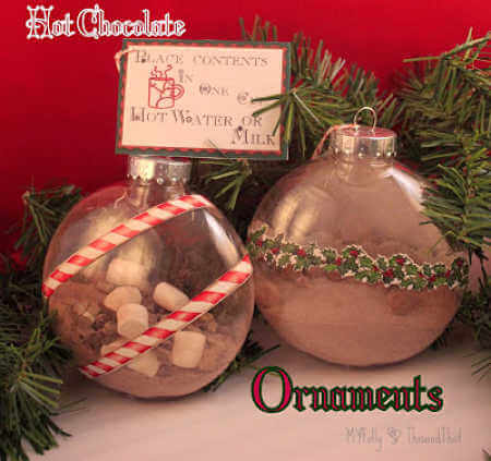 We've rounded up over 30 Easy Homemade Christmas Ornaments. These DIY ornament ideas are simple to make and many use what you already have. Try these fun DIY craft ideas! Your kids will love making these easy handmade ornaments for Christmas! #onecrazymom #christmasornaments #DIYornaments Hot Cocoa ornaments ready for gift giving by the tree.