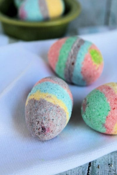 Try some of these quick and easy Easter crafts for kids. The ideas are endless and fun for the entire family. Find 20+ easy Easter crafts. Egg shaped bath bombs grouped together.