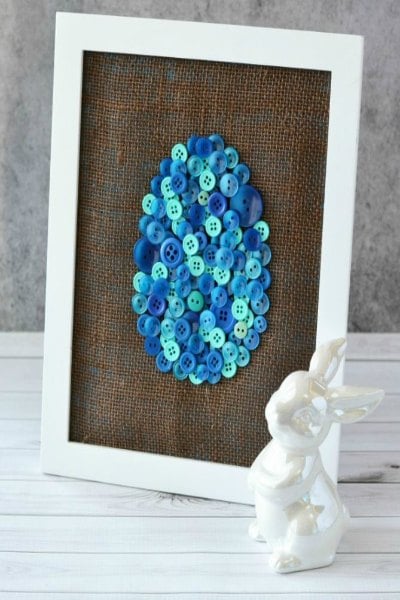 Try some of these quick and easy Easter crafts for kids. The ideas are endless and fun for the entire family. Find 20+ easy Easter crafts. Easter egg button art in a white frame.