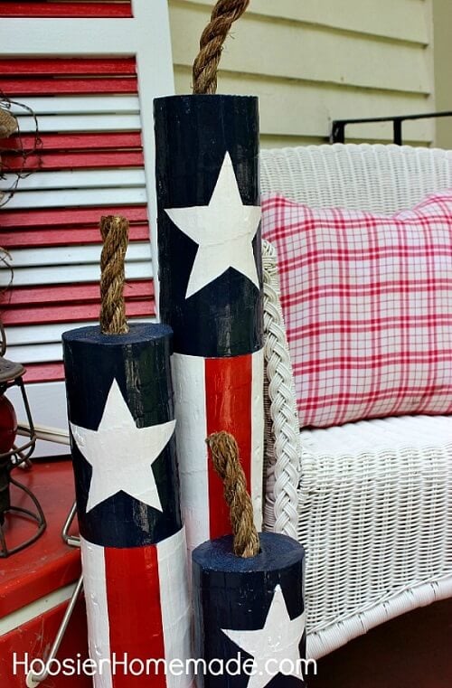 Check out these Fourth of July Crafts. You can make any celebration patriotic with these 4th of July Crafts for your home. Wooden firecrackers on porch.