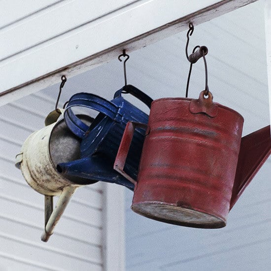 Take a look at these easy 4th of July Front Porch Ideas. Your house will be so festive with these 4th of July front porch decorating ideas. Patriotic front porch ideas for the 4th are simple and easy. Try these 4th of July decorations for the front porch. 12 Easy patriotic decorations for the porch you will love. Watering cans hanging.