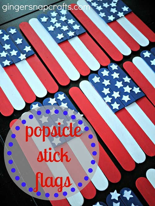 Check out these Fourth of July Crafts. You can make any celebration patriotic with these 4th of July Crafts for your home. Popsicle stick flags on table.