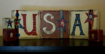 Check out these Fourth of July Crafts. You can make any celebration patriotic with these 4th of July Crafts for your home. DIY blocks on table.