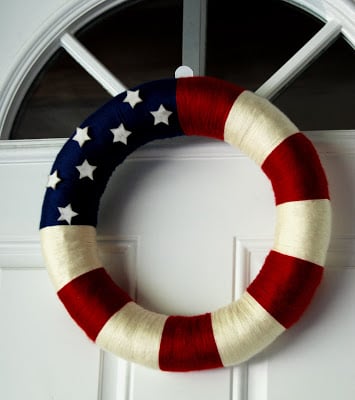 Check out these Fourth of July Crafts. You can make any celebration patriotic with these 4th of July Crafts for your home. Yarn wreath on door.
