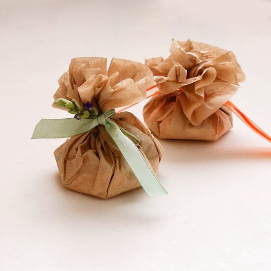 If you're looking for easy ways to make your home and car smell amazing, try one of these DIY Air Fresheners.These ideas are natural and smell wonderful. Coffee filter sachets with ribbon.