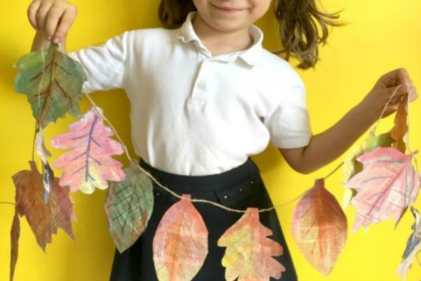 Get inspired with these Thanksgiving home decorations.20 DIY Thanksgiving Decorations you will love.Thanksgiving home decorations that won't bust the budget Leaf garland in a child's hand.