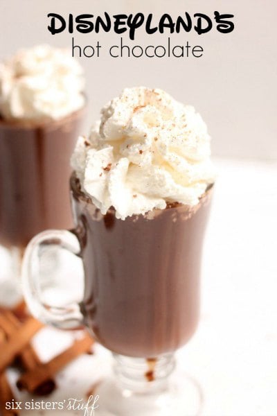 Try these easy hot chocolate recipes for an amazing treat everyone will love this Winter. 20 of the best hot cocoa recipes. You will love these homemade hot chocolate recipes that are made in the crock pot, some with cocoa powder. Learn how to make your own hot chocolate at home! #eatingonadime #hotchocolaterecipes #drinkrecipes #winterrecipes Clear mug with Disneyland hot chocolate.