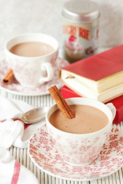 Try these easy hot chocolate recipes for an amazing treat everyone will love this Winter. 20 of the best hot cocoa recipes. You will love these homemade hot chocolate recipes that are made in the crock pot, some with cocoa powder. Learn how to make your own hot chocolate at home! #eatingonadime #hotchocolaterecipes #drinkrecipes #winterrecipes Vegan Chai Hot Chocolate in a tea cup.