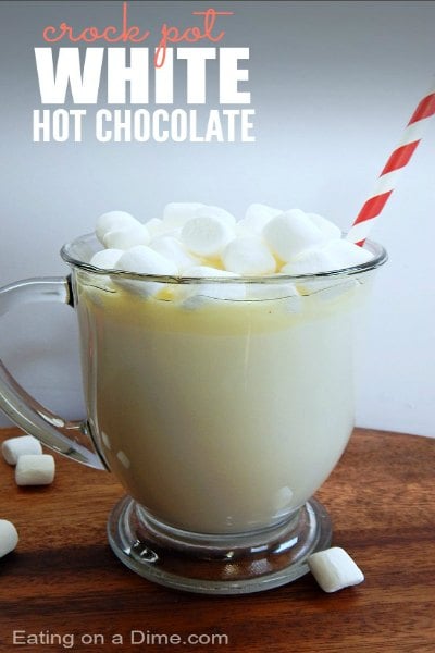 Try these easy hot chocolate recipes for an amazing treat everyone will love this Winter. 20 of the best hot cocoa recipes. You will love these homemade hot chocolate recipes that are made in the crock pot, some with cocoa powder. Learn how to make your own hot chocolate at home! #eatingonadime #hotchocolaterecipes #drinkrecipes #winterrecipes Crock pot white hot chocolate in a clear mug.