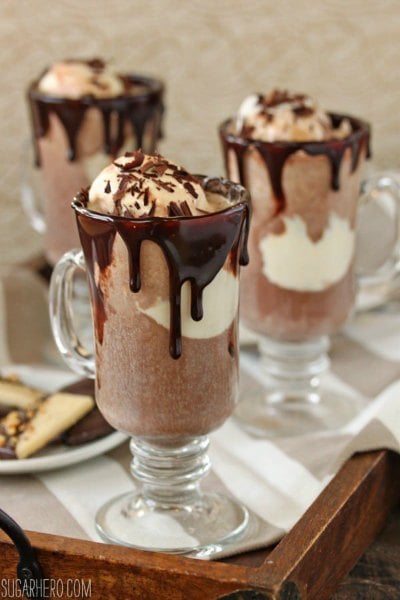 Try these easy hot chocolate recipes for an amazing treat everyone will love this Winter. 20 of the best hot cocoa recipes. You will love these homemade hot chocolate recipes that are made in the crock pot, some with cocoa powder. Learn how to make your own hot chocolate at home! #eatingonadime #hotchocolaterecipes #drinkrecipes #winterrecipes Hot chocolate floats in clear glasses.