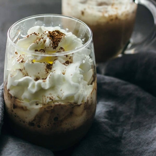 Try these easy hot chocolate recipes for an amazing treat everyone will love this Winter. 20 of the best hot cocoa recipes. You will love these homemade hot chocolate recipes that are made in the crock pot, some with cocoa powder. Learn how to make your own hot chocolate at home! #eatingonadime #hotchocolaterecipes #drinkrecipes #winterrecipes Icelandic hot chocolate in a glass.