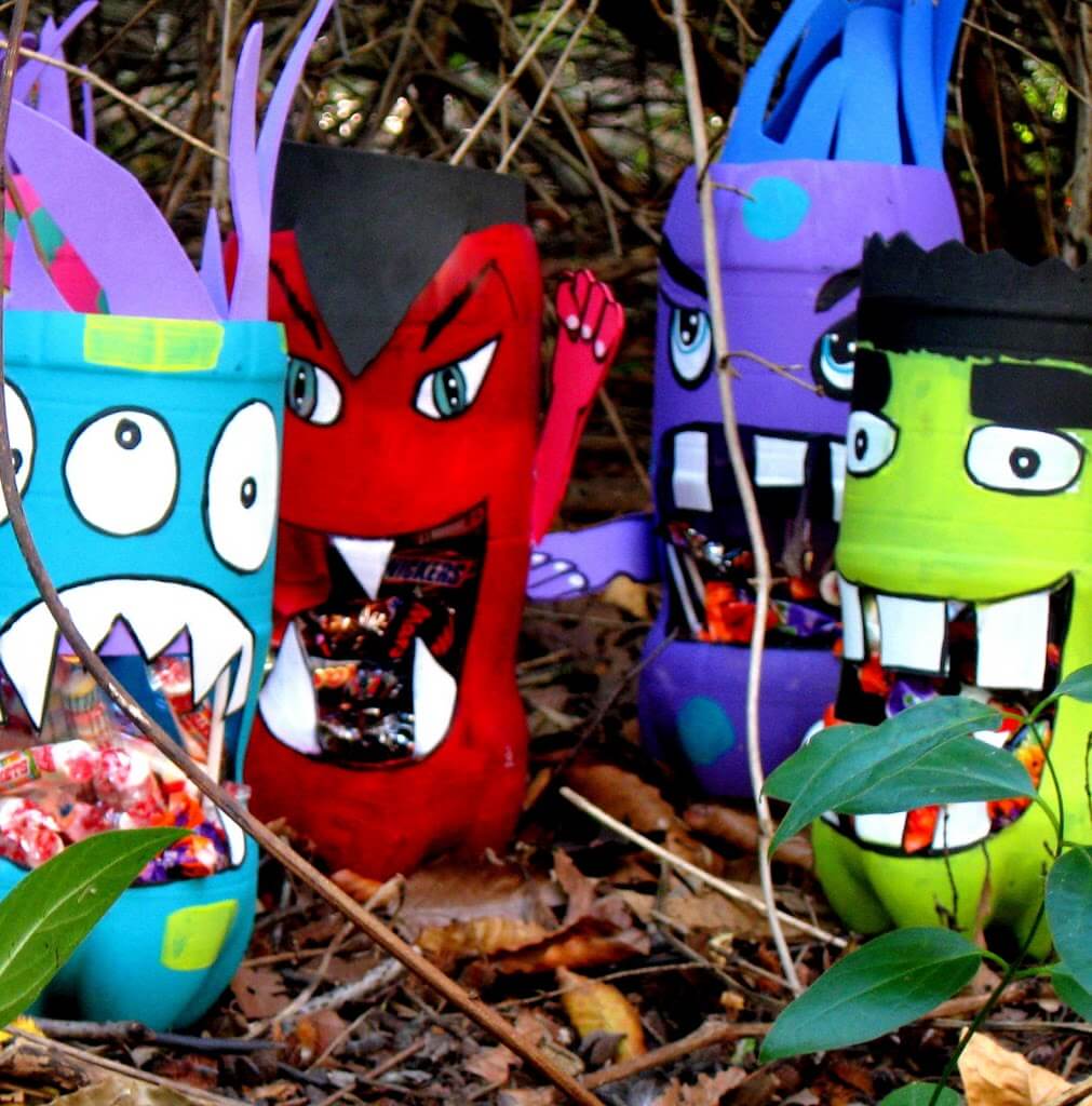 I think you will love these water bottle crafts for kids. These are perfect for keeping the kids busy without breaking the bank! Try 12 water bottle crafts for kids recycled. Your kids are going to love these DIY plastic bottle crafts! #onecrazymom #crafts #craftideas Plastic bottle monsters with candy.