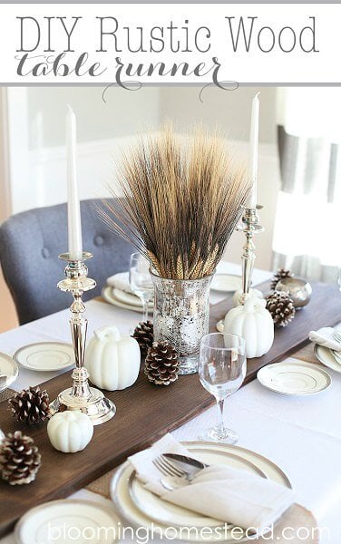 Make your table beautiful with these easy Thanksgiving table decor ideas. 20 Thanksgiving table decorating ideas that are budget friendly and easy to make. Wooden table runner topped with pinecones.