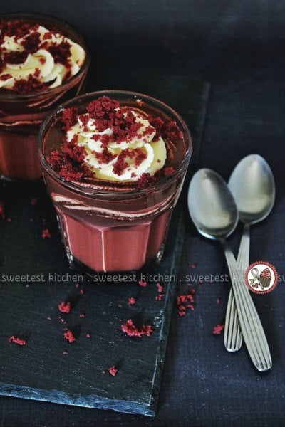 Try these easy hot chocolate recipes for an amazing treat everyone will love this Winter. 20 of the best hot cocoa recipes. You will love these homemade hot chocolate recipes that are made in the crock pot, some with cocoa powder. Learn how to make your own hot chocolate at home! #eatingonadime #hotchocolaterecipes #drinkrecipes #winterrecipes Red velvet hot chocolate in a clear glass.