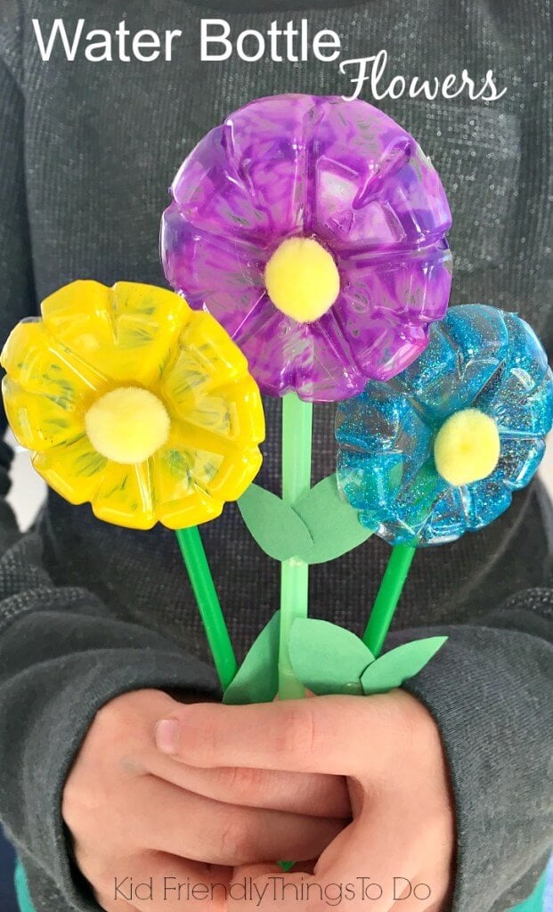 I think you will love these water bottle crafts for kids. These are perfect for keeping the kids busy without breaking the bank! Try 12 water bottle crafts for kids recycled. Your kids are going to love these DIY plastic bottle crafts! #onecrazymom #crafts #craftideas Flower bouquet from water bottles.