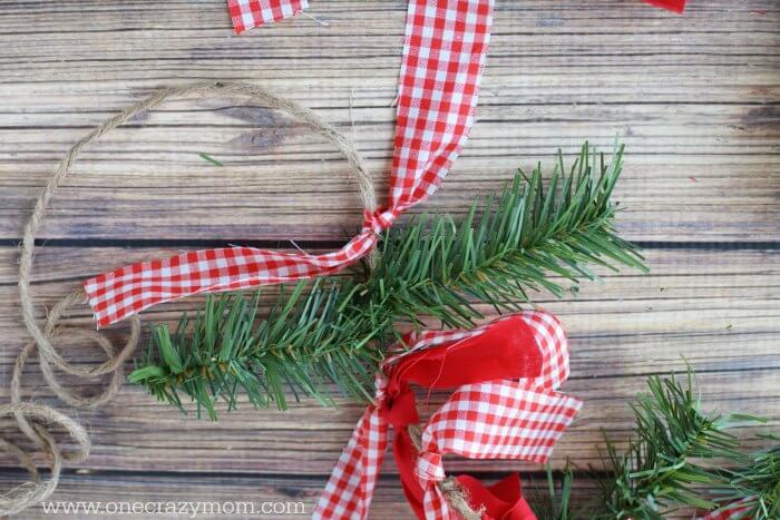 Garland makes your home festive for Christmas. DIY Christmas garland is perfect for the mantle or anywhere you need a festive touch. It's so easy to make! Garland with ribbon.