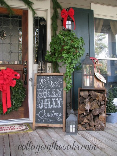 Get your home ready for Christmas with these 25 Christmas Porch Decorating Ideas. Beautiful Christmas porch ideas that are simple and budget friendly! Vintage Chalkboard sign on the porch.