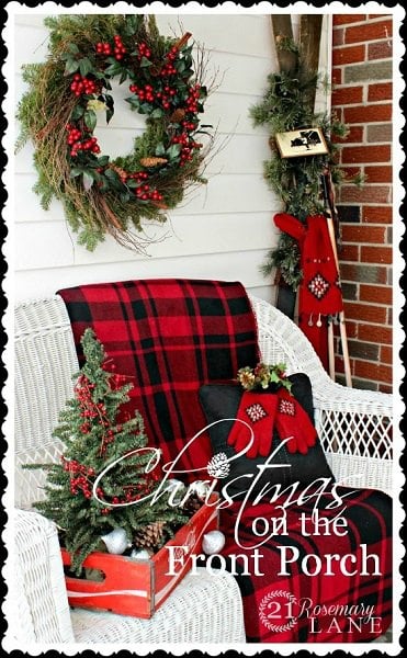 Get your home ready for Christmas with these 25 Christmas Porch Decorating Ideas. Beautiful Christmas porch ideas that are simple and budget friendly! Wicker furniture with plaid blanket.