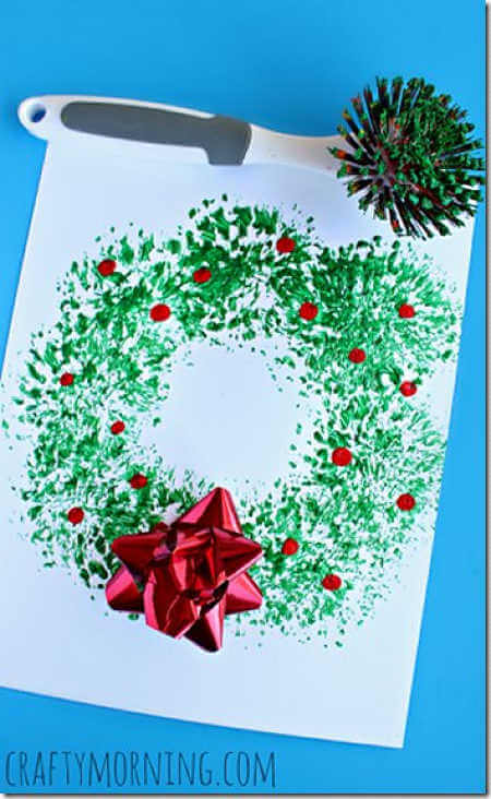 Find Easy Christmas Crafts for kids that are easy to do. They will love these Christmas crafts for kids. 20 Christmas craft ideas for kids that are frugal and great for gifts or ornaments. These fun projects are great for toddlers and older kids too. Perfect for school or for Christmas decorations! #onecrazymom #christmascrafts #kidcrafts Christmas wreath painting with bow.