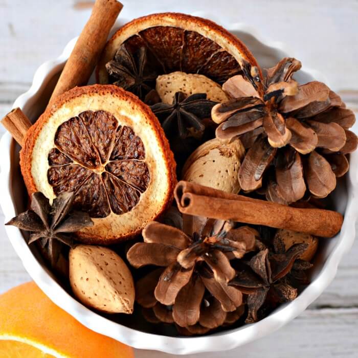 Learn how to make homemade Christmas Potpourri that smells amazing. It is so easy! Find out how to make potpourri with very little effort or expense. Christmas Potpourri in a bowl.