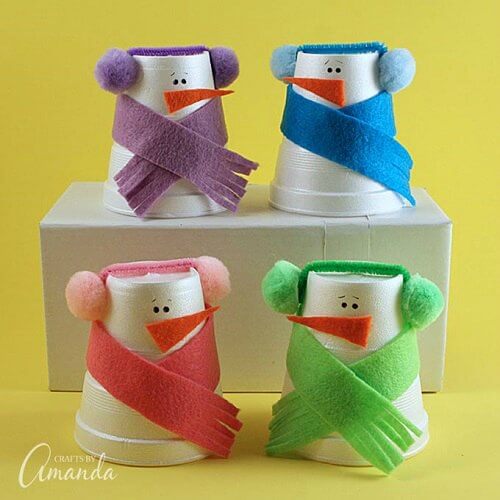 Find Easy Christmas Crafts for kids that are easy to do. They will love these Christmas crafts for kids. 20 Christmas craft ideas for kids that are frugal and great for gifts or ornaments. These fun projects are great for toddlers and older kids too. Perfect for school or for Christmas decorations! #onecrazymom #christmascrafts #kidcrafts Foam snowman cups in various colors.