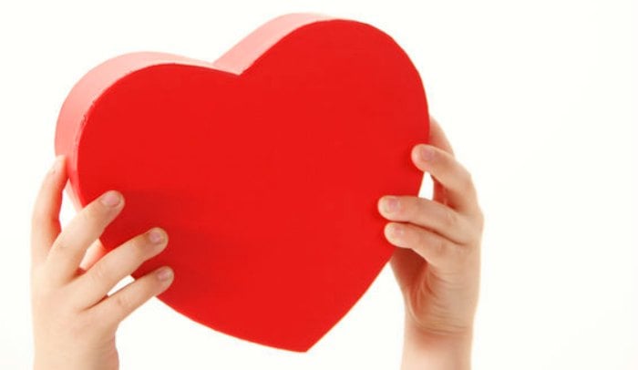 Valentine's Day Ideas for him that he will love. 9 Valentine gifts for him that don't take much advance planning. Mens valentines gifts that won't bust the budget. Valentines Day presents for him that won't take a ton of time. Valentines day gift ideas for him. Hands holding a heart.