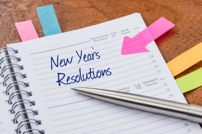 Find New Years Resolution ideas to get the year started right! 5 New Year Resolution Ideas you can keep. New Years Resolutions Ideas for the new year. Planner with a note for New Year's Resolutions.