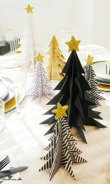 Create Christmas table top decorations with these easy ideas. 15 DIY Christmas table decorations anyone can make. Simple Christmas table decoration ideas. Origami trees displayed on the table.