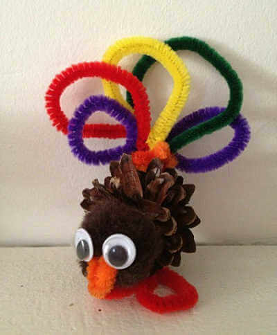 The kids will have a blast wiith these fun and easy Thanksgiving crafts for toddlers. 20 easy Thanksgiving crafts for toddlers they will love. Pinecone turkey craft with pipe cleaner feathers.